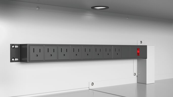 A row of electrical outlets in a lithium ion battery cabinet