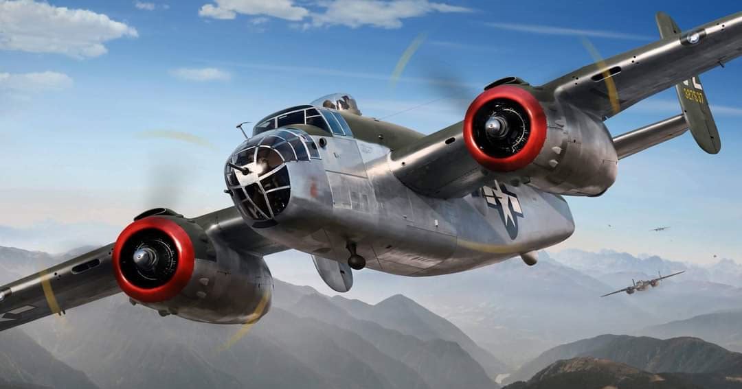 WWII B-25 bomber flying over mountains