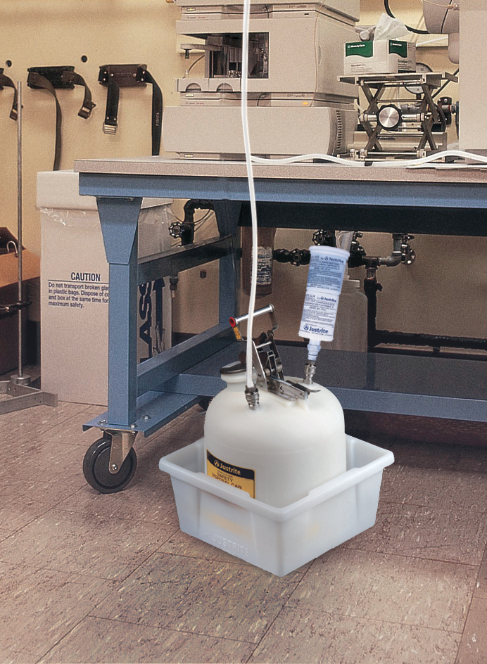 Justrite HPLC hazardous waste quick disconnect container sitting in white spill basin