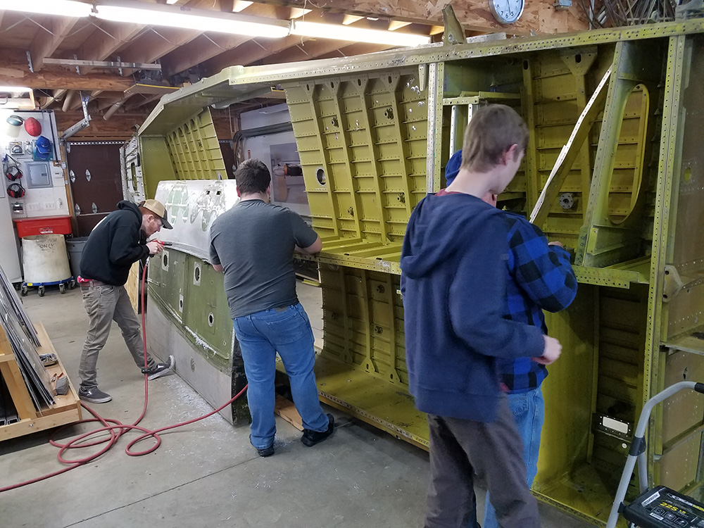 Students working in Warbirds of Glory apprenticeship program